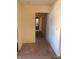 Hallway with neutral walls, trim, and carpet flooring at 2141 N Cole St, Indianapolis, IN 46224
