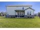 Expansive backyard with lush green lawn and a covered patio, perfect for outdoor activities at 2168 Hengist Dr, Westfield, IN 46074