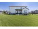Large backyard featuring a well-maintained lawn and a cozy patio area at 2168 Hengist Dr, Westfield, IN 46074