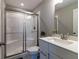Modern bathroom featuring a tiled shower with glass door, and a white vanity at 2168 Hengist Dr, Westfield, IN 46074