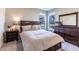 Cozy bedroom featuring a queen-sized bed, bedside tables, and dark wood furnishings at 2168 Hengist Dr, Westfield, IN 46074