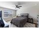 Contemporary bedroom with gray walls, wood-look floors, desk, and a dark gray comforter at 2168 Hengist Dr, Westfield, IN 46074