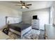 Comfortable bedroom with a full-sized bed, ceiling fan, and a large window for natural light at 2168 Hengist Dr, Westfield, IN 46074