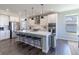 Modern kitchen with stainless steel appliances, white cabinets, and a large island at 2168 Hengist Dr, Westfield, IN 46074