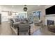 Open-concept living room flowing into the kitchen, with a fireplace and hardwood floors at 2168 Hengist Dr, Westfield, IN 46074