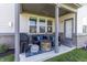 Covered patio with comfortable seating, a fire pit, and a ceiling fan for outdoor living at 2168 Hengist Dr, Westfield, IN 46074