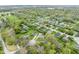Overhead shot displaying a community with mature trees and single-Gathering houses at 225 Vali Ct, Carmel, IN 46280