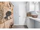 Bathroom with bear shower curtain, white cabinets, white countertop, and decorative basket at 225 Vali Ct, Carmel, IN 46280