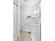 Bright white bathroom with tiled floors, vanity, toilet, and shower with curtain at 225 Vali Ct, Carmel, IN 46280