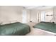 Spacious bedroom with beige walls, neutral carpet, and two beds for flexible living at 225 Vali Ct, Carmel, IN 46280