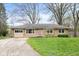 Charming single-story home featuring a stone facade and a well-maintained front yard at 225 Vali Ct, Carmel, IN 46280