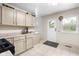 Bright and airy kitchen area with a view to the outside and adjacent rooms at 225 Vali Ct, Carmel, IN 46280