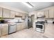 Well-equipped kitchen featuring stainless steel appliances and ample cabinet space at 225 Vali Ct, Carmel, IN 46280