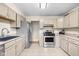 Functional kitchen layout with modern appliances and plenty of countertop area at 225 Vali Ct, Carmel, IN 46280