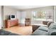 Cozy living room with ample natural light, hardwood floors, and neutral tones at 225 Vali Ct, Carmel, IN 46280