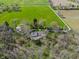 Aerial view of a home surrounded by trees and green fields. Great curb appeal! at 2394 W 600 S, New Palestine, IN 46163