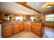 Open kitchen boasts an island with a built in range and ample counter space for meal prep and entertaining at 2394 W 600 S, New Palestine, IN 46163