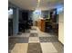 Finished basement with workspace, bar area, and unique carpet flooring, creating a versatile and inviting space at 263 Clark Ave, Beech Grove, IN 46107