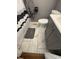 Tiled bathroom featuring a vanity, toilet, and stylish tile flooring at 263 Clark Ave, Beech Grove, IN 46107