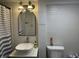 Modern bathroom featuring a vessel sink, textured white tile, and stylish lighting for an updated look at 263 Clark Ave, Beech Grove, IN 46107