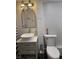 Well-lit bathroom with modern fixtures and unique wall texture at 263 Clark Ave, Beech Grove, IN 46107