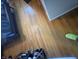 Close-up view of hardwood floors in a bedroom, showing a bed and some shoes at 263 Clark Ave, Beech Grove, IN 46107