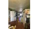 The kitchen features a wooden dining table and white cabinetry at 263 Clark Ave, Beech Grove, IN 46107