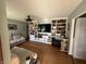 Open-concept living room featuring hardwood floors, built-in bookcases, and ample seating at 263 Clark Ave, Beech Grove, IN 46107