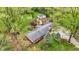 Aerial view of property showing house, garage, and treed lot at 2920 N Buck Creek Rd, Greenfield, IN 46140