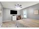 Bedroom with a ceiling fan, TV, and a window offering natural light at 2920 N Buck Creek Rd, Greenfield, IN 46140