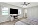 Well-lit bedroom with a ceiling fan and TV, offering a comfortable and relaxing space at 2920 N Buck Creek Rd, Greenfield, IN 46140