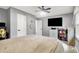 Comfortable bedroom featuring a TV, ceiling fan, and a view of additional doors and windows at 2920 N Buck Creek Rd, Greenfield, IN 46140