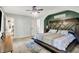 Bright bedroom featuring a custom wooden headboard with a ceiling fan overhead at 2920 N Buck Creek Rd, Greenfield, IN 46140