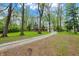 Long driveway leads to a brick home with lush greenery at 2920 N Buck Creek Rd, Greenfield, IN 46140