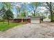 This inviting single-story brick home offers a well-maintained exterior with a detached garage and ample parking space at 2920 N Buck Creek Rd, Greenfield, IN 46140