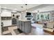 Open concept kitchen with stainless steel appliances flowing into a living room with a fireplace at 2920 N Buck Creek Rd, Greenfield, IN 46140