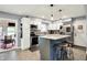 Modern kitchen featuring white cabinets, stainless steel appliances, and a stylish island with stool seating at 2920 N Buck Creek Rd, Greenfield, IN 46140