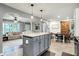 Open kitchen with a view to the connected living room, sliding barn door, and a dining area at 2920 N Buck Creek Rd, Greenfield, IN 46140