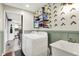 Functional laundry room with modern appliances, shelving, and convenient access to the kitchen at 2920 N Buck Creek Rd, Greenfield, IN 46140