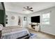 Bright and spacious main bedroom with a ceiling fan, large windows, and a decorative accent wall at 2920 N Buck Creek Rd, Greenfield, IN 46140