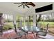 Comfortable enclosed patio featuring a round table with chairs and a view of the backyard at 2920 N Buck Creek Rd, Greenfield, IN 46140