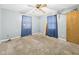 Bedroom featuring carpeted floors, painted walls, and a standard ceiling fan at 306 W Clyde St, Frankton, IN 46044
