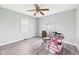 An alternate bedroom featuring gray floors, painted walls, and a standard ceiling fan at 306 W Clyde St, Frankton, IN 46044