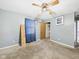 A bedroom with painted walls, carpeted floors, a standard ceiling fan, and a closet at 306 W Clyde St, Frankton, IN 46044