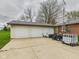 Spacious three-car garage with ample parking and storage space for vehicles and equipment at 306 W Clyde St, Frankton, IN 46044
