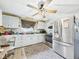 Bright kitchen featuring ample counter space, tile backsplash, and stainless steel appliances at 306 W Clyde St, Frankton, IN 46044