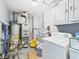 Well-equipped utility room with water heater, washer, and plenty of storage space for laundry and household needs at 306 W Clyde St, Frankton, IN 46044