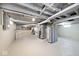 Spacious basement with exposed pipes, painted for a clean look and ready for customization at 316 S Arlington Ave, Indianapolis, IN 46219