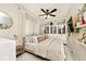 Comfortable bedroom featuring ample closet space and a ceiling fan for climate control at 316 S Arlington Ave, Indianapolis, IN 46219