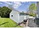 Detached garage with well-maintained siding and a lush green lawn at 316 S Arlington Ave, Indianapolis, IN 46219
